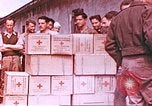Image of Liberated American airmen and Red Cross aid at Stalag 7A prison camp Moosburg Germany, 1945, second 1 stock footage video 65675060145
