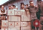 Image of Liberated American airmen and Red Cross aid at Stalag 7A prison camp Moosburg Germany, 1945, second 3 stock footage video 65675060145