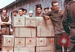 Image of Liberated American airmen and Red Cross aid at Stalag 7A prison camp Moosburg Germany, 1945, second 4 stock footage video 65675060145