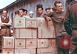 Image of Liberated American airmen and Red Cross aid at Stalag 7A prison camp Moosburg Germany, 1945, second 5 stock footage video 65675060145