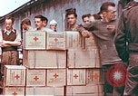 Image of Liberated American airmen and Red Cross aid at Stalag 7A prison camp Moosburg Germany, 1945, second 6 stock footage video 65675060145