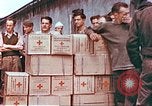 Image of Liberated American airmen and Red Cross aid at Stalag 7A prison camp Moosburg Germany, 1945, second 7 stock footage video 65675060145