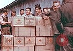 Image of Liberated American airmen and Red Cross aid at Stalag 7A prison camp Moosburg Germany, 1945, second 9 stock footage video 65675060145