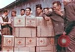 Image of Liberated American airmen and Red Cross aid at Stalag 7A prison camp Moosburg Germany, 1945, second 10 stock footage video 65675060145