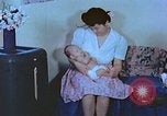 Image of Japanese-American family in Internment camp United States USA, 1942, second 36 stock footage video 65675060168