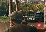 Image of soldiers of Mobile Riverine Force Dong Tam Vietnam, 1968, second 52 stock footage video 65675060289