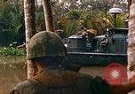 Image of soldiers of Mobile Riverine Force Dong Tam Vietnam, 1968, second 57 stock footage video 65675060289