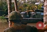 Image of soldiers of Mobile Riverine Force Dong Tam Vietnam, 1968, second 58 stock footage video 65675060289