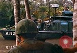 Image of soldiers of Mobile Riverine Force Dong Tam Vietnam, 1968, second 60 stock footage video 65675060289