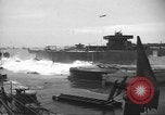 Image of concrete barges Normandy France, 1944, second 16 stock footage video 65675060370