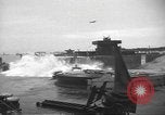 Image of concrete barges Normandy France, 1944, second 29 stock footage video 65675060370