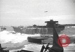 Image of concrete barges Normandy France, 1944, second 36 stock footage video 65675060370