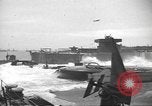 Image of concrete barges Normandy France, 1944, second 38 stock footage video 65675060370