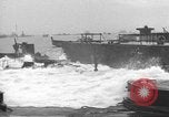 Image of concrete barges Normandy France, 1944, second 51 stock footage video 65675060370