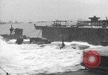 Image of concrete barges Normandy France, 1944, second 52 stock footage video 65675060370