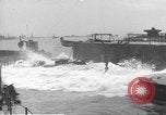 Image of concrete barges Normandy France, 1944, second 58 stock footage video 65675060370
