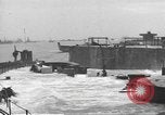 Image of concrete barges Normandy France, 1944, second 61 stock footage video 65675060370