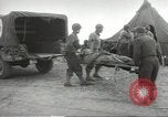 Image of US wounded soldiers being treated at field hospital Normandy France, 1944, second 23 stock footage video 65675060421