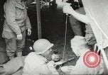 Image of US wounded soldiers being treated at field hospital Normandy France, 1944, second 32 stock footage video 65675060421