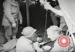 Image of US wounded soldiers being treated at field hospital Normandy France, 1944, second 33 stock footage video 65675060421
