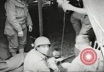 Image of US wounded soldiers being treated at field hospital Normandy France, 1944, second 34 stock footage video 65675060421