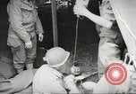 Image of US wounded soldiers being treated at field hospital Normandy France, 1944, second 35 stock footage video 65675060421