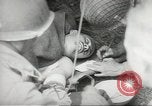 Image of US wounded soldiers being treated at field hospital Normandy France, 1944, second 36 stock footage video 65675060421