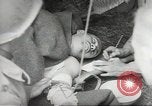 Image of US wounded soldiers being treated at field hospital Normandy France, 1944, second 37 stock footage video 65675060421