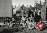 Image of US wounded soldiers being treated at field hospital Normandy France, 1944, second 41 stock footage video 65675060421