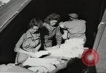 Image of US wounded soldiers being treated at field hospital Normandy France, 1944, second 55 stock footage video 65675060421