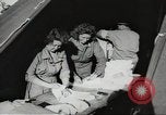 Image of US wounded soldiers being treated at field hospital Normandy France, 1944, second 57 stock footage video 65675060421