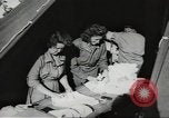 Image of US wounded soldiers being treated at field hospital Normandy France, 1944, second 58 stock footage video 65675060421