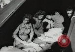 Image of US wounded soldiers being treated at field hospital Normandy France, 1944, second 60 stock footage video 65675060421
