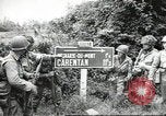 Image of United States troops greeted by French civilians Sainte-Marie-du-Mont France, 1944, second 1 stock footage video 65675060425