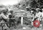 Image of United States troops greeted by French civilians Sainte-Marie-du-Mont France, 1944, second 4 stock footage video 65675060425