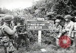 Image of United States troops greeted by French civilians Sainte-Marie-du-Mont France, 1944, second 5 stock footage video 65675060425