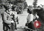 Image of United States troops greeted by French civilians Sainte-Marie-du-Mont France, 1944, second 6 stock footage video 65675060425