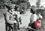 Image of United States troops greeted by French civilians Sainte-Marie-du-Mont France, 1944, second 7 stock footage video 65675060425