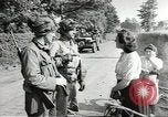 Image of United States troops greeted by French civilians Sainte-Marie-du-Mont France, 1944, second 8 stock footage video 65675060425