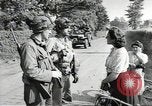 Image of United States troops greeted by French civilians Sainte-Marie-du-Mont France, 1944, second 9 stock footage video 65675060425