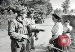 Image of United States troops greeted by French civilians Sainte-Marie-du-Mont France, 1944, second 10 stock footage video 65675060425