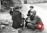 Image of United States troops greeted by French civilians Sainte-Marie-du-Mont France, 1944, second 15 stock footage video 65675060425
