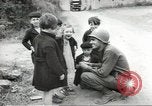 Image of United States troops greeted by French civilians Sainte-Marie-du-Mont France, 1944, second 16 stock footage video 65675060425