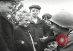 Image of United States troops greeted by French civilians Sainte-Marie-du-Mont France, 1944, second 17 stock footage video 65675060425