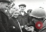 Image of United States troops greeted by French civilians Sainte-Marie-du-Mont France, 1944, second 18 stock footage video 65675060425