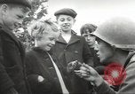 Image of United States troops greeted by French civilians Sainte-Marie-du-Mont France, 1944, second 20 stock footage video 65675060425
