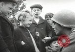 Image of United States troops greeted by French civilians Sainte-Marie-du-Mont France, 1944, second 21 stock footage video 65675060425