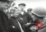 Image of United States troops greeted by French civilians Sainte-Marie-du-Mont France, 1944, second 22 stock footage video 65675060425