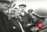 Image of United States troops greeted by French civilians Sainte-Marie-du-Mont France, 1944, second 23 stock footage video 65675060425