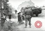 Image of United States troops greeted by French civilians Sainte-Marie-du-Mont France, 1944, second 27 stock footage video 65675060425